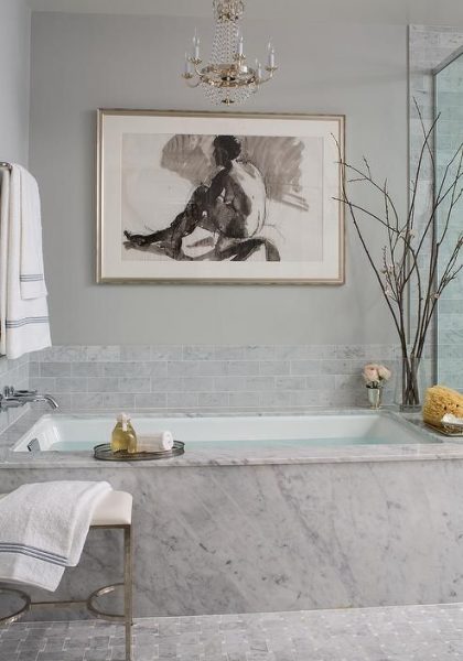 Marble Clad Bathtub with Paris Flea Market Chandelier - Transitional - Bathroom